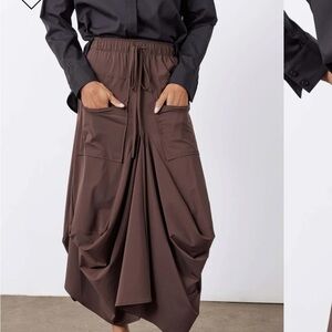 Elegant Tan Maxi Skirt by Ruti.
color tan/Not brown as in stock photos .